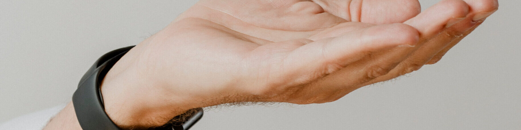 Presenting arm isolated on beige